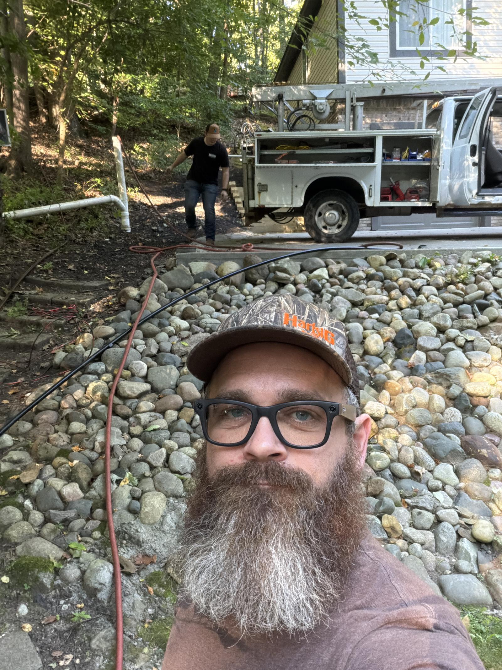 Maglothin crew at a well pump pull with the pump hoist truck in Clarkston, MI